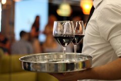 Red wine glasses on a tray
